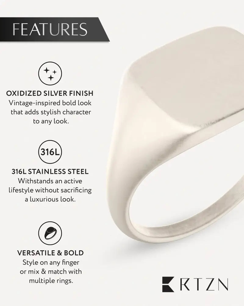 A sleek oxidized silver square signet ring made of 316l stainless steel with a vintage-inspired design