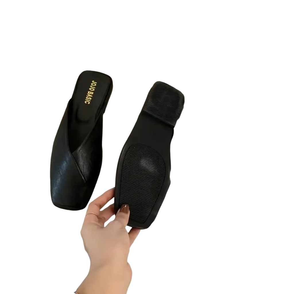 Black leather square toe flat mules with quilted design for stylish and comfortable wear