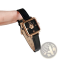 A delicate square women quartz watch with rose gold case, burgundy leather strap, and floral design on dark dial
