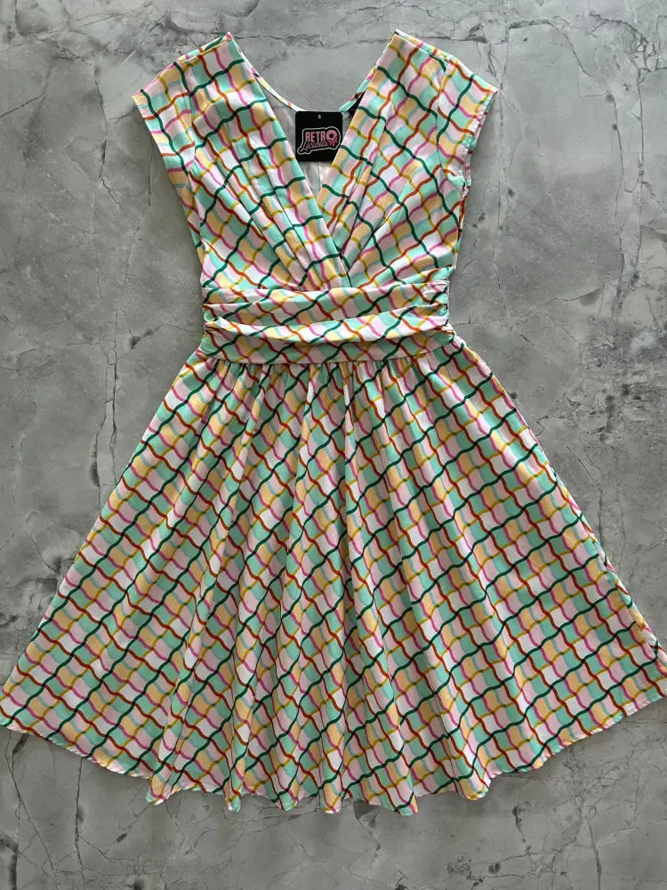 Squiggly greta vintage cotton v neck dress with pockets in pastel mint green peach and pink geometric grid pattern