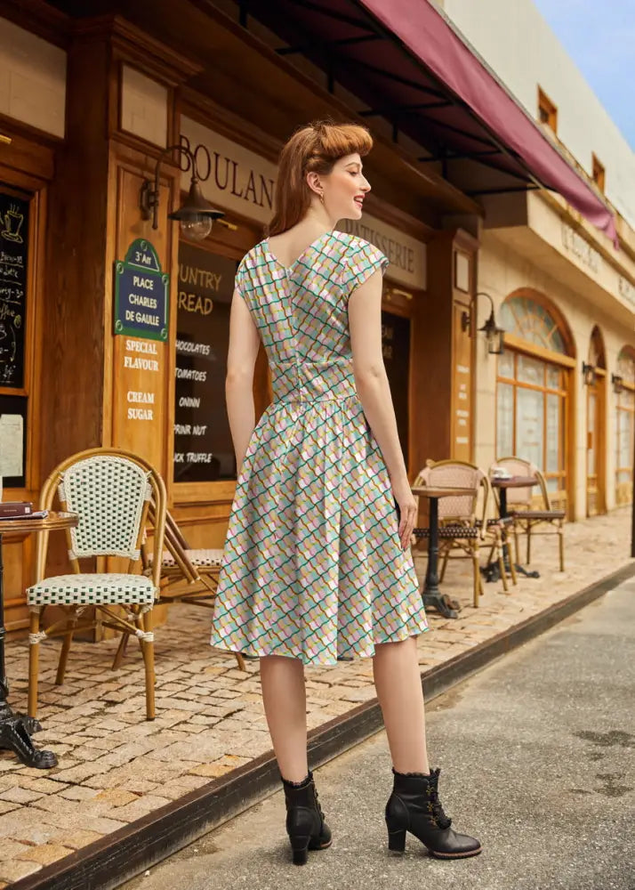 Squiggly Greta vintage cotton V-neck dress with pockets featuring a light green and white plaid pattern and short sleeves