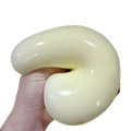 A smooth glossy yellow squishy ball stress relief toy with soft flexible texture and elongated curved shape