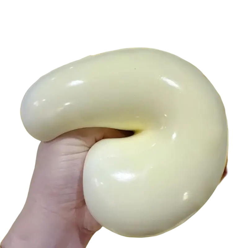 A smooth glossy yellow squishy ball stress relief toy with soft flexible texture and elongated curved shape