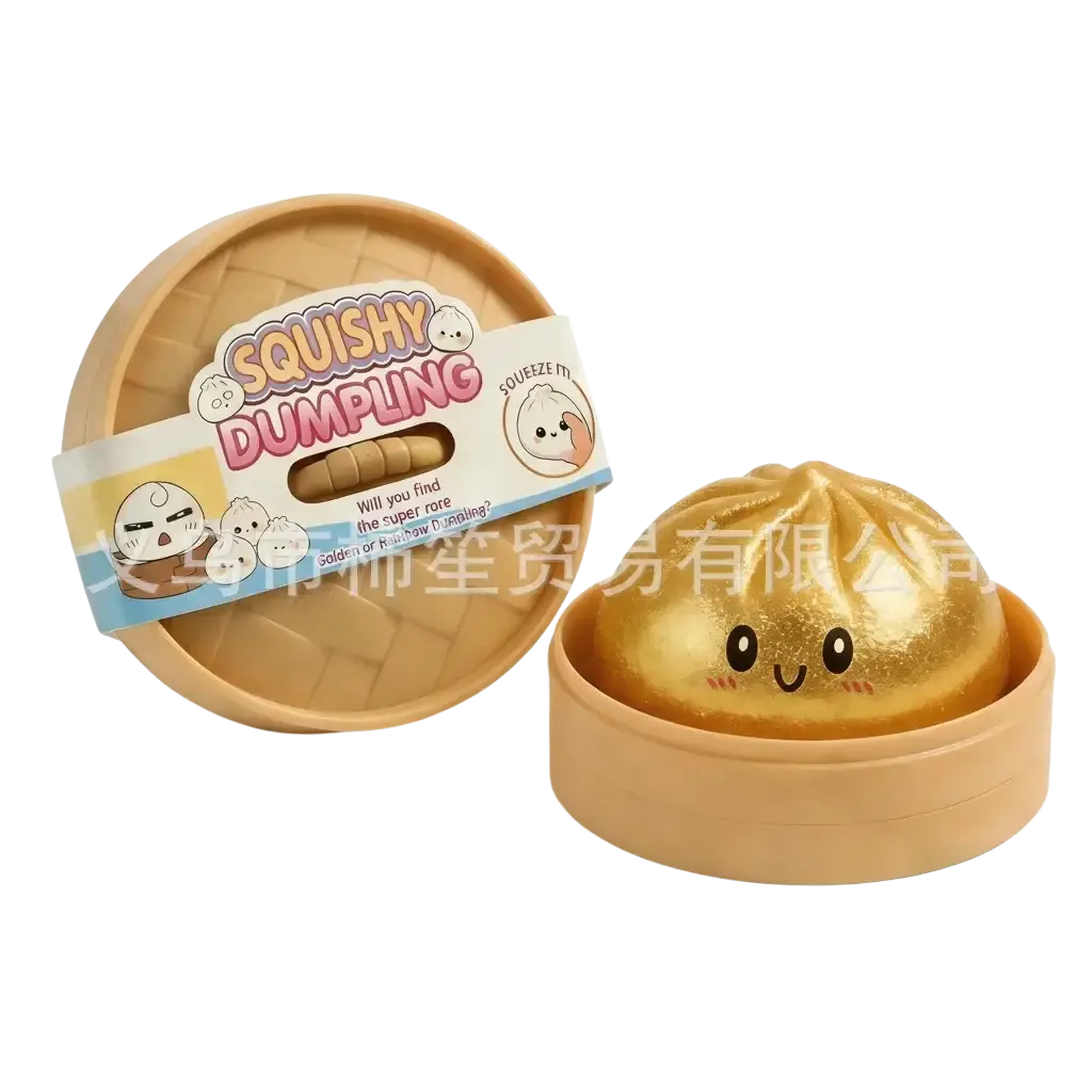 Golden squishy dumpling stress ball with a smiling face in a tan plastic steamer basket finished goods product