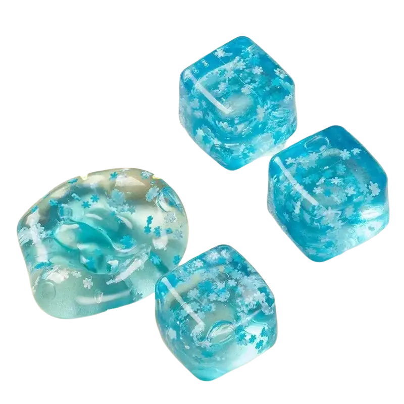 Blue translucent cube-shaped squishy snowflake ice cubes filled with maltose and tiny white snowflake particles