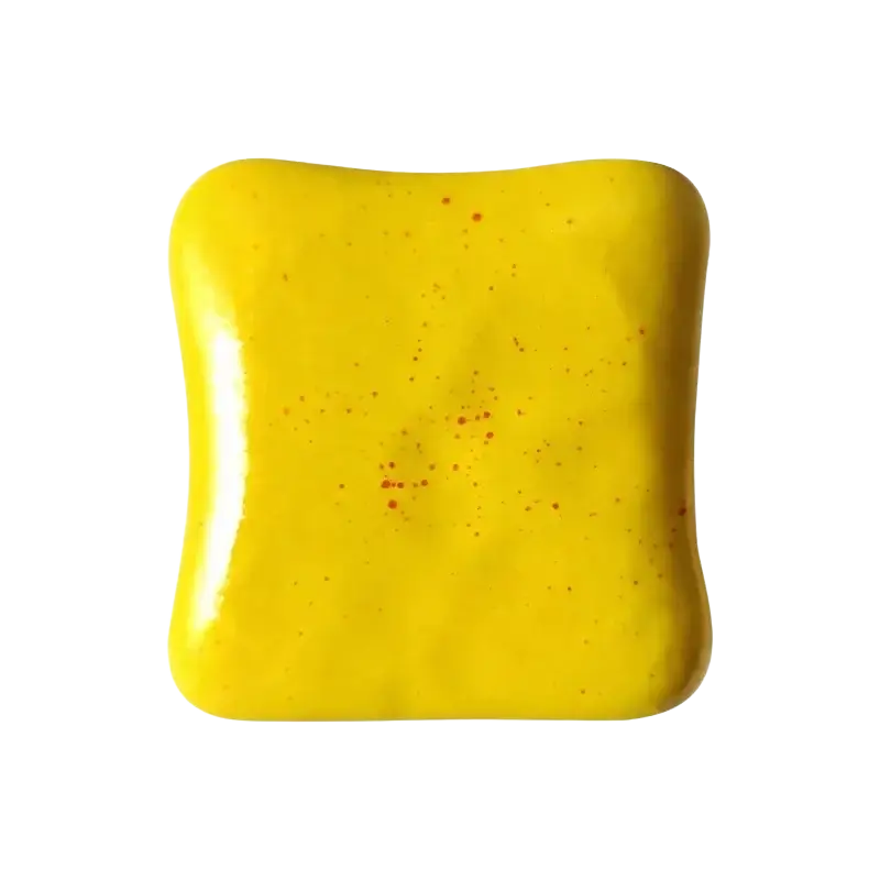 Squishy toast stress relief toy in vibrant yellow ceramic tile with rounded edges and subtle red speckles macaron color
