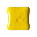 Squishy toast stress relief toy in vibrant yellow ceramic tile with rounded edges and subtle red speckles macaron color