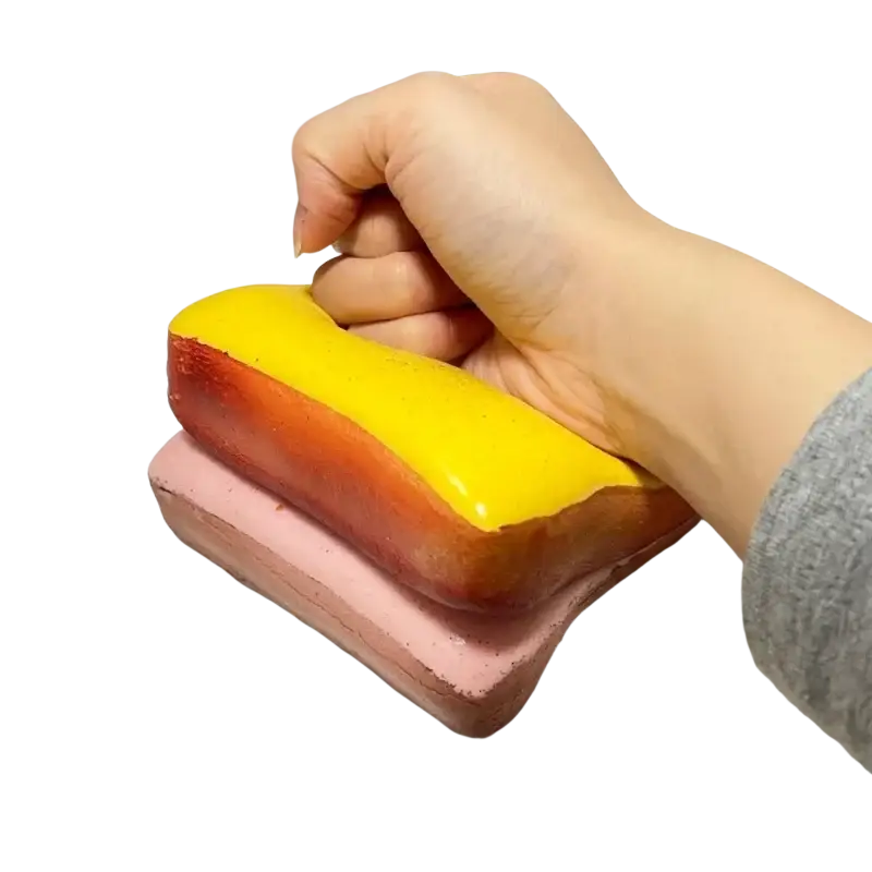 Yellow and pink silicone squishy toast stress relief toy in macaron color for stress relief and sensory play