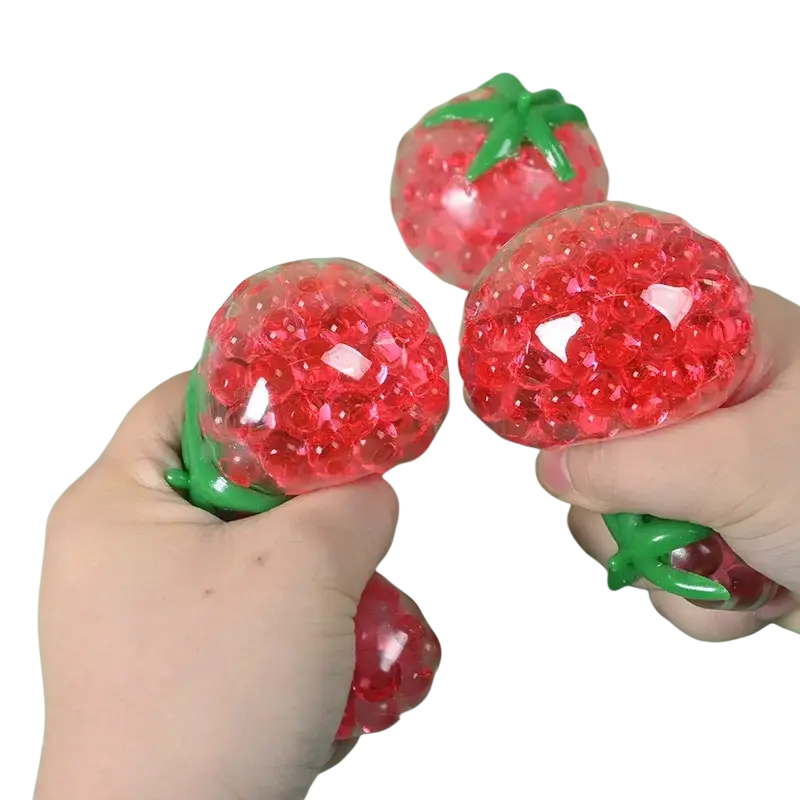 Squishy tomato stress relief toy gel bead squeeze ball shaped like a red strawberry with translucent beads and green stems