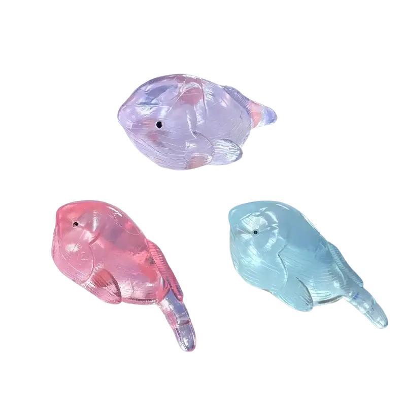 Squishy whale fidget toy stress ball set featuring transparent plastic fish-shaped stress relievers in random colors