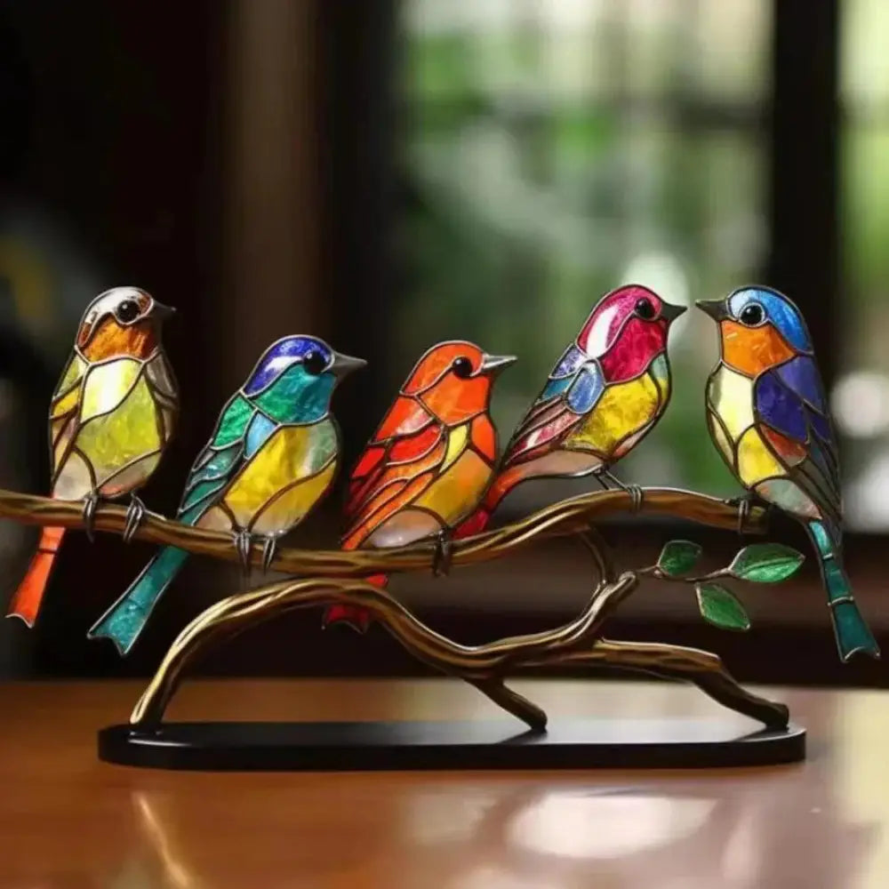 Vibrant stained glass birds figurines with intricate color patterns perched on a bronze branch home decor
