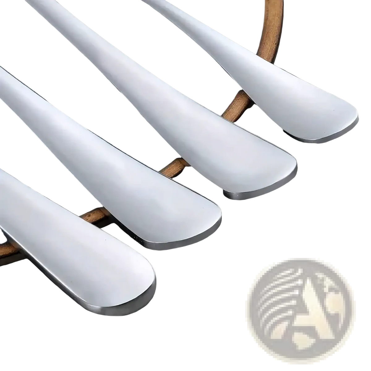 Set of four sleek modern stainless steel spoons with polished handles in a 16-piece cutlery set