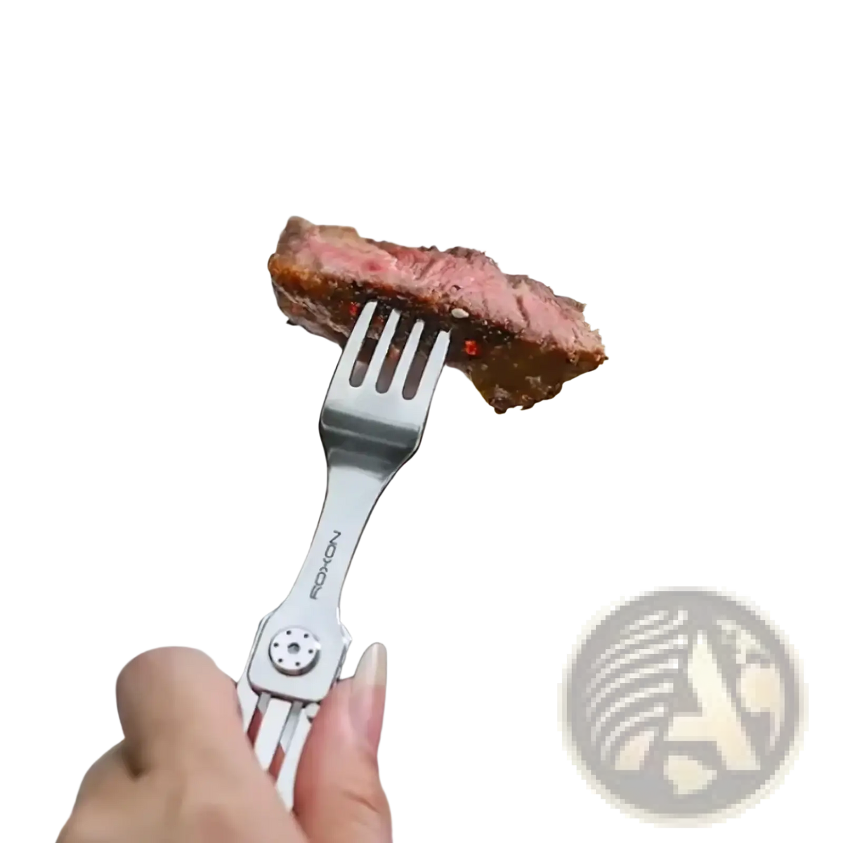 A sleek silver-toned stainless steel 3-in-1 camping cutlery fork holding a slice of medium-rare steak