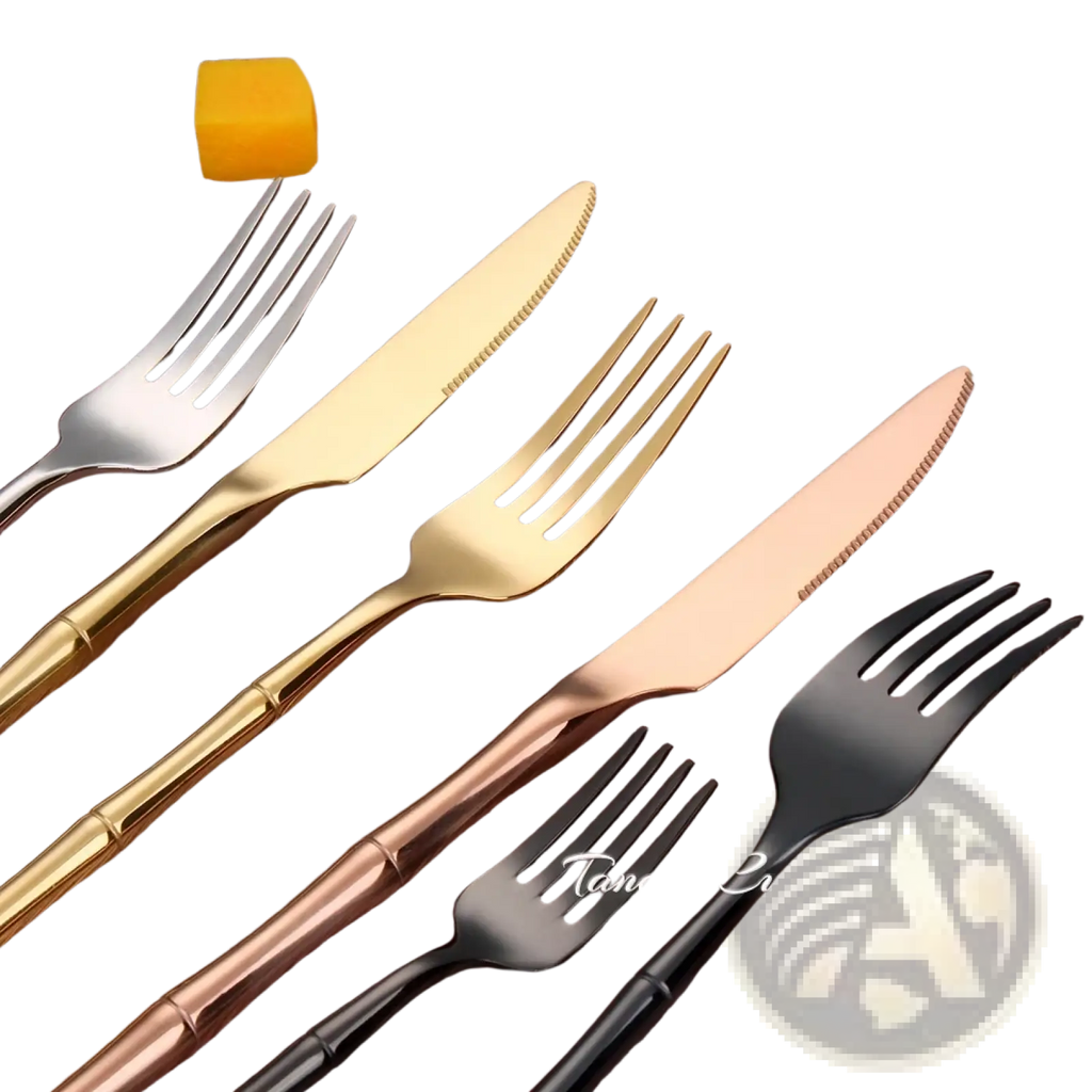 Set of four stainless steel bamboo cutlery pieces with gold rose gold and black handles in modern design
