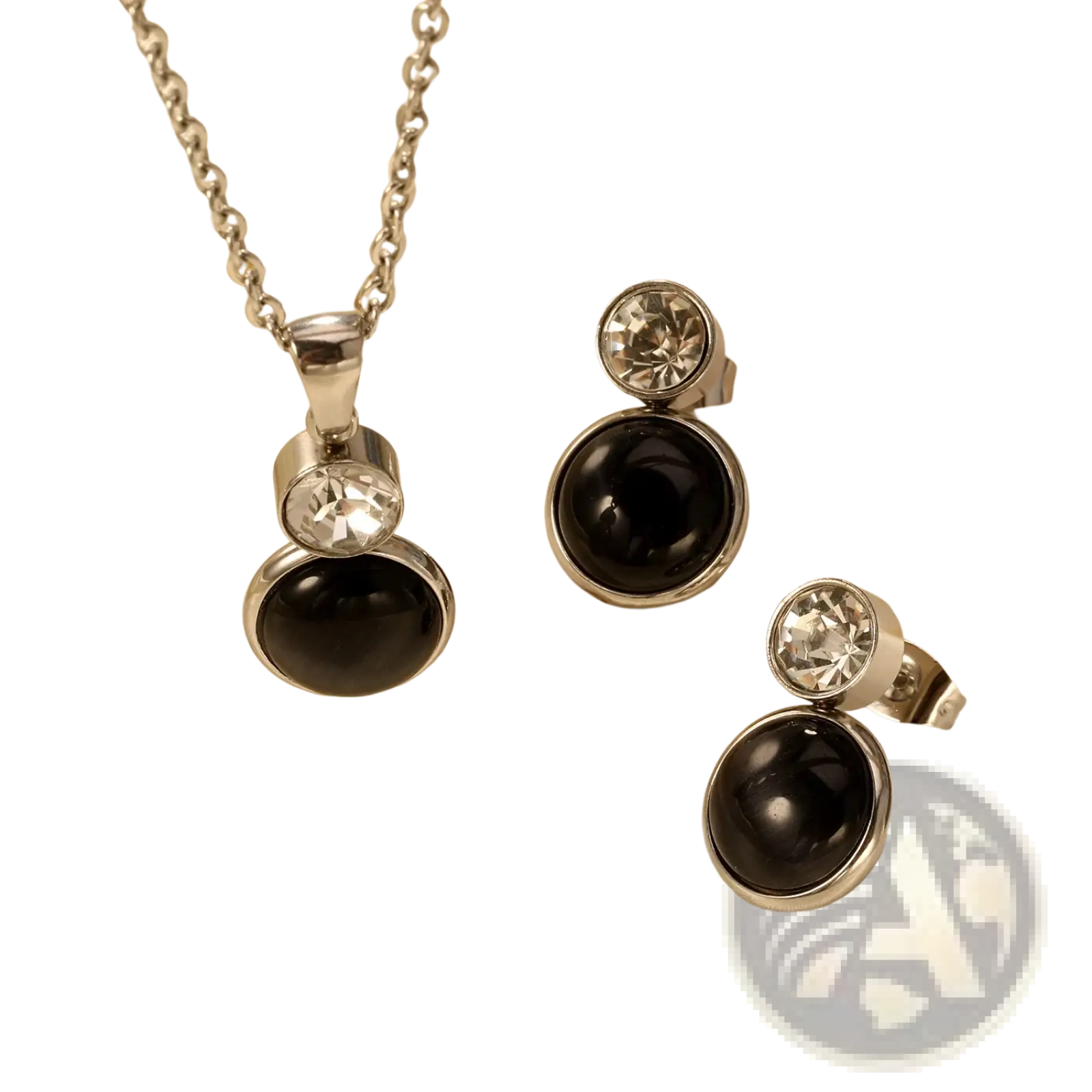 Silver-toned stainless steel black onyx necklace and earring set with clear crystal accents for elegant wear