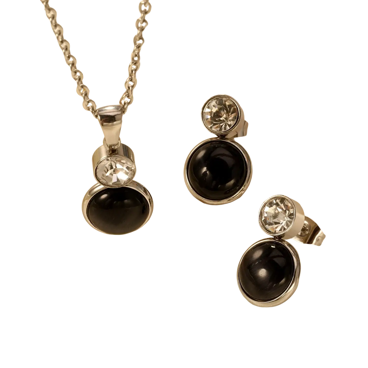 Silver-toned stainless steel black onyx necklace and earring set with clear crystal accents for elegant wear