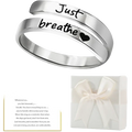 A sleek silver stainless steel double-band just breathe anxiety wrap ring with engraved phrase and small heart