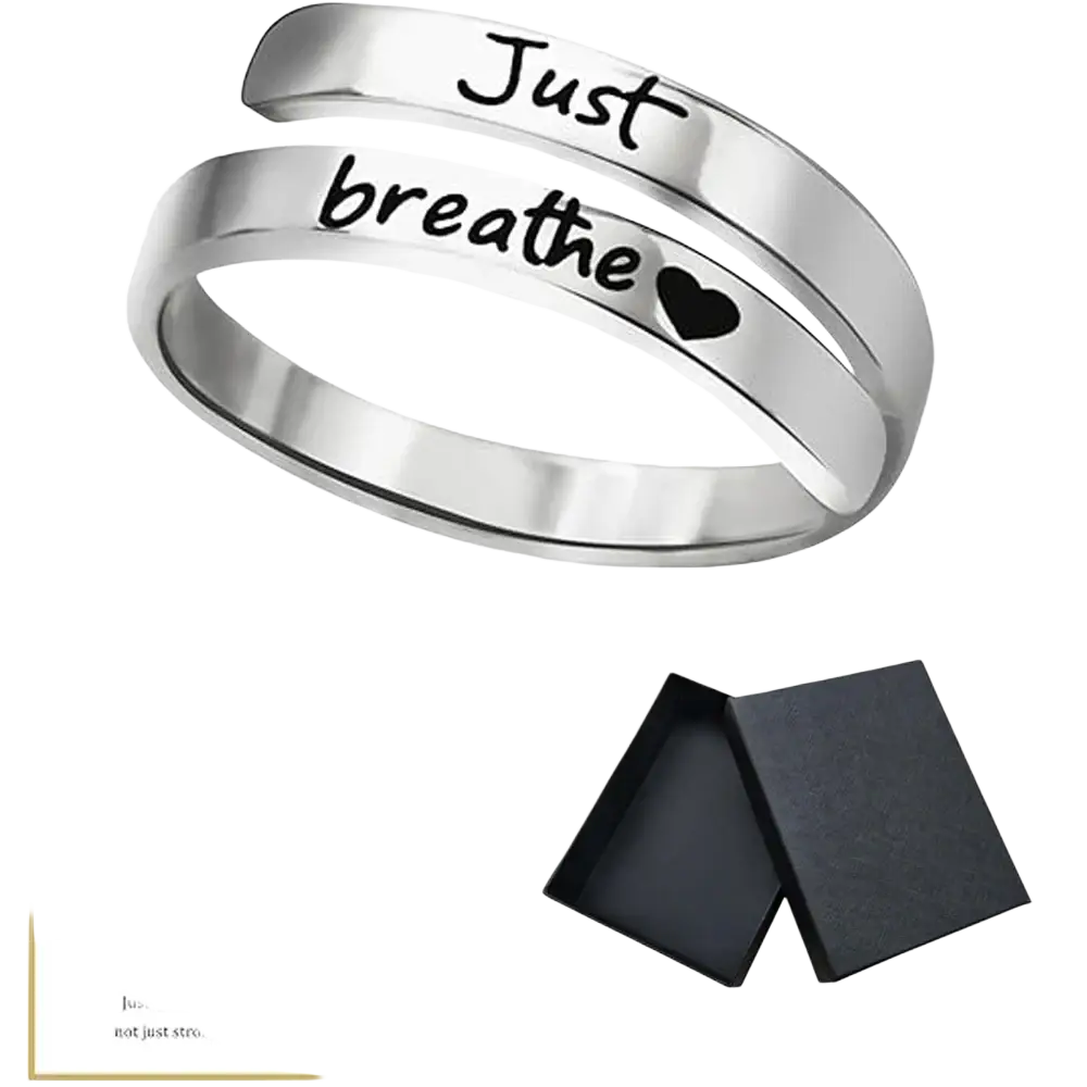 A sleek silver-toned stainless steel just breathe anxiety wrap ring engraved with just breathe and a small heart
