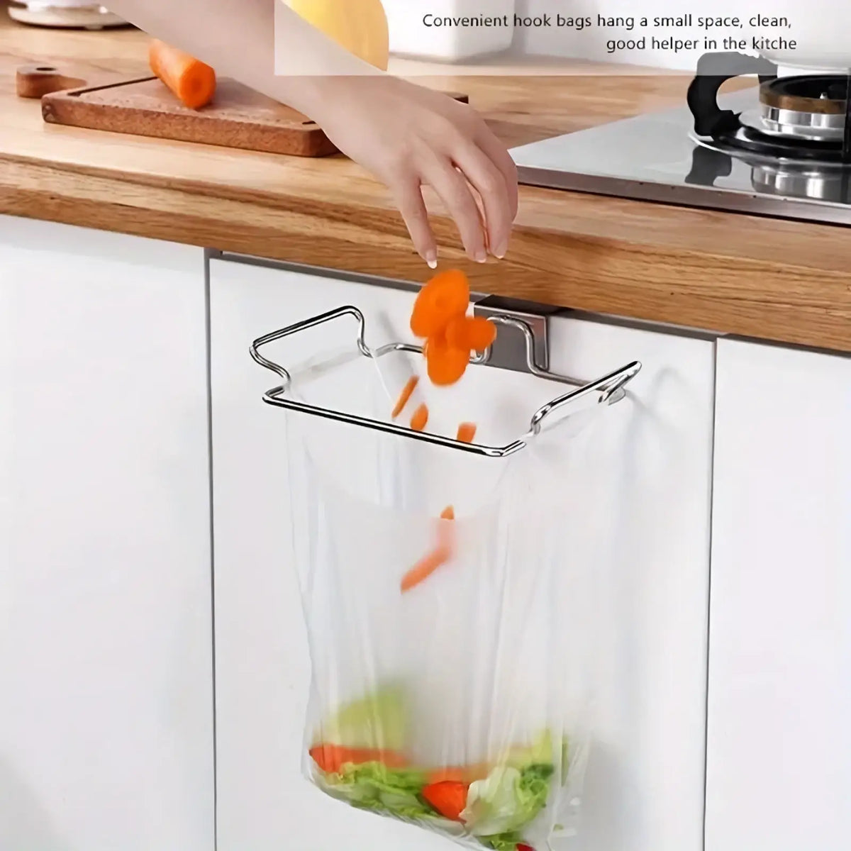 Stainless steel cabinet garbage rack holder with clear plastic trash bag and metallic hook frame hanging under cabinet