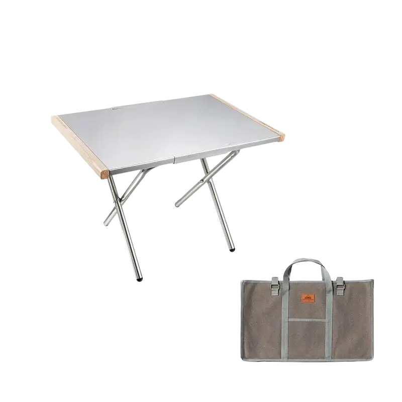 Compact silver stainless steel camping table with light wood edges and matching gray storage bag for outdoor use
