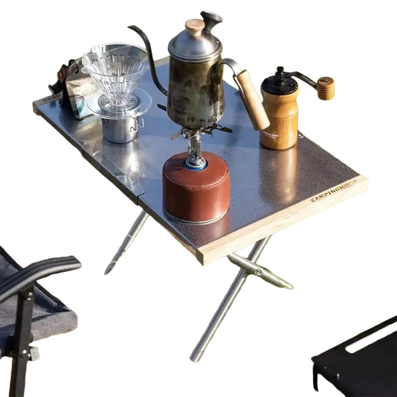 Silver stainless steel camping table with wooden edges metal legs and storage bag for outdoor furniture use