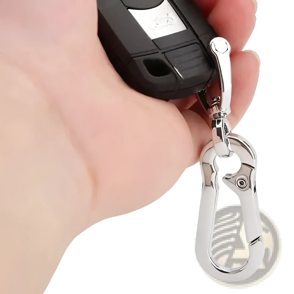 Silver stainless steel carabiner car keychain attached to a black car key fob for secure key organization