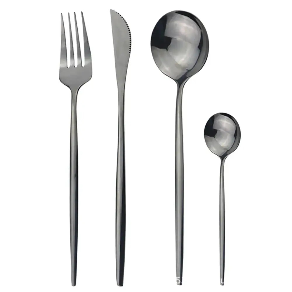 Modern gold polished stainless steel flatware set with sleek minimalist design and matte black smooth handles