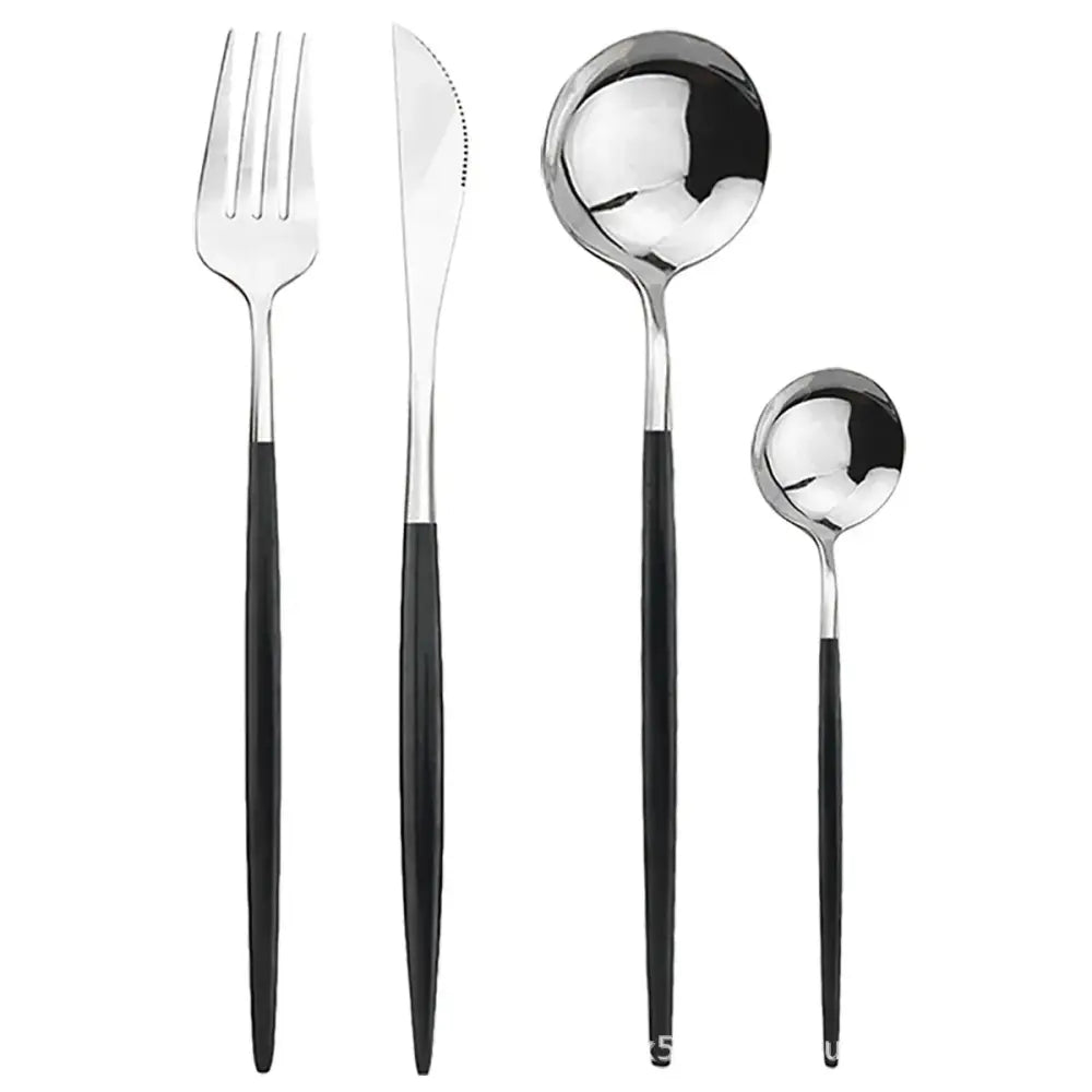 Modern gold polished stainless steel flatware set with sleek black handles and polished metallic blades