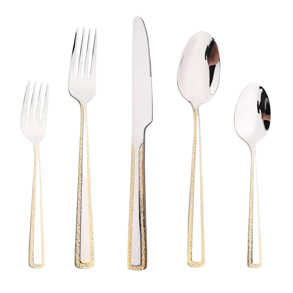 Set of stainless steel cutlery with gold accent textured handles and polished silver blades for elegant dining