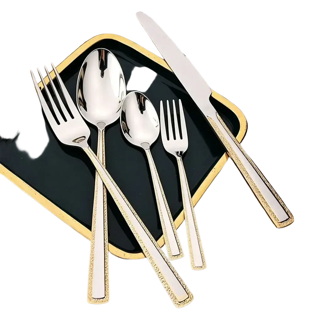Shiny silver-toned stainless steel cutlery set with gold-accented handles including fork spoon and knife on black tray