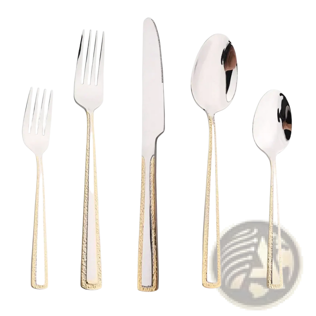 Set of stainless steel cutlery with gold accent textured handles and polished silver blades for elegant dining