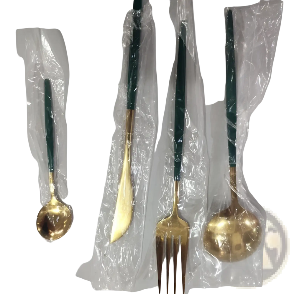 Set of four stainless steel cutlery pieces with gold-toned blades and dark green handles wrapped in clear plastic
