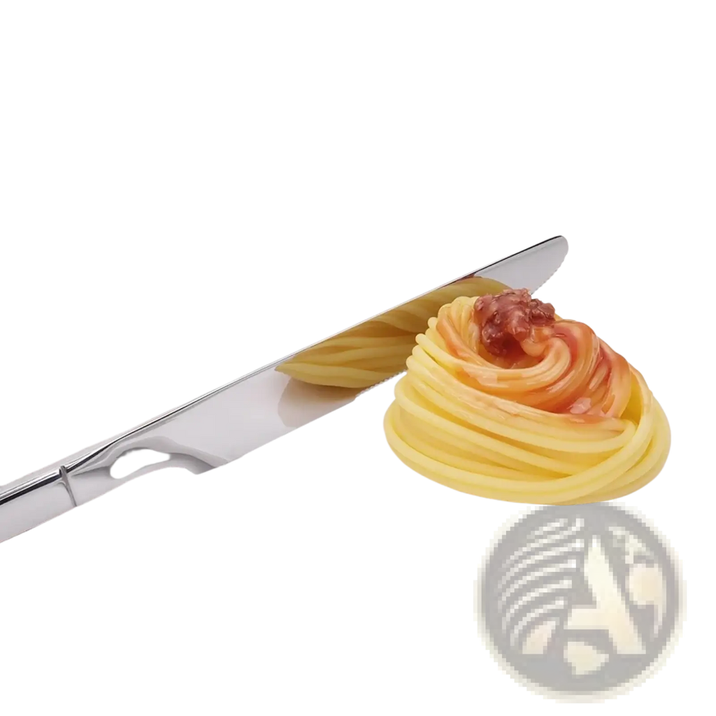 Shiny stainless steel butter knife with mirror finish resting beside an artfully arranged pasta dish in cutlery set