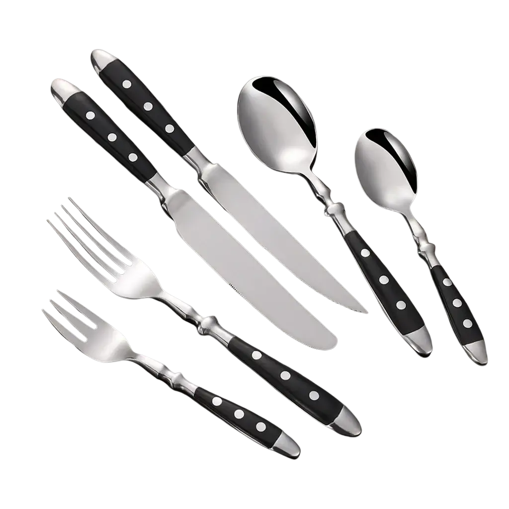 Stainless steel cutlery set with black handles featuring white polka dots for stylish table settings