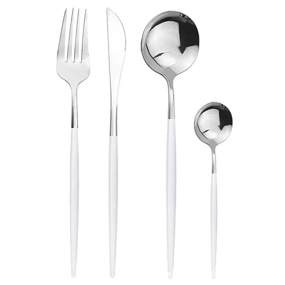 Modern gold polished stainless steel flatware set with sleek white handles featuring fork knife and spoons in minimalist design