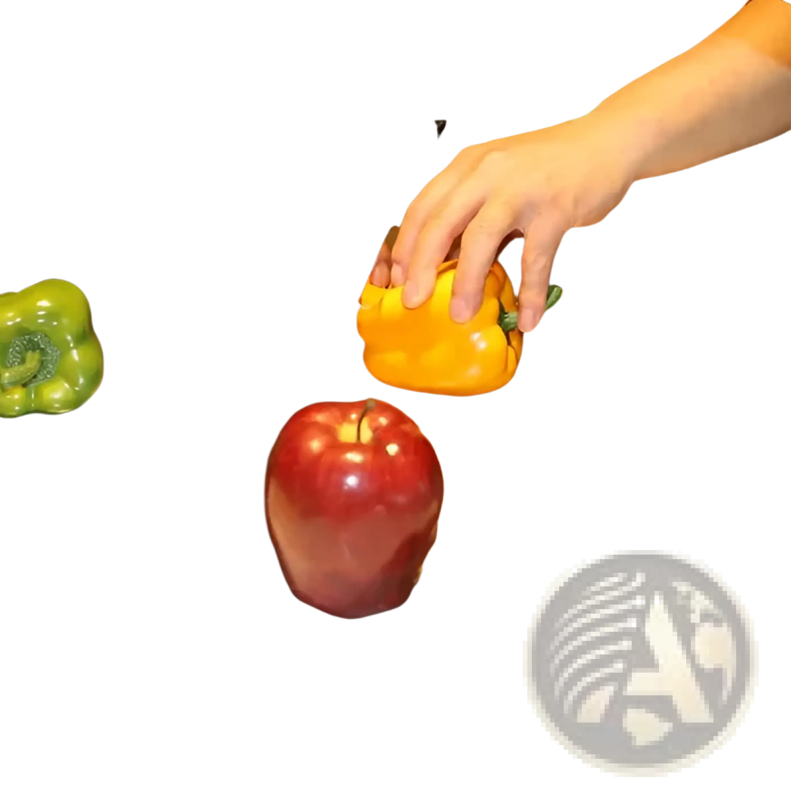 Shiny stainless steel cutting board with lip and sealed lid featuring reflective surface with bell peppers and apple
