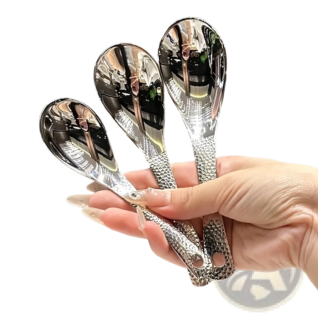 Set of three polished stainless steel dessert spoons with hammered textured handles and reflective bowls