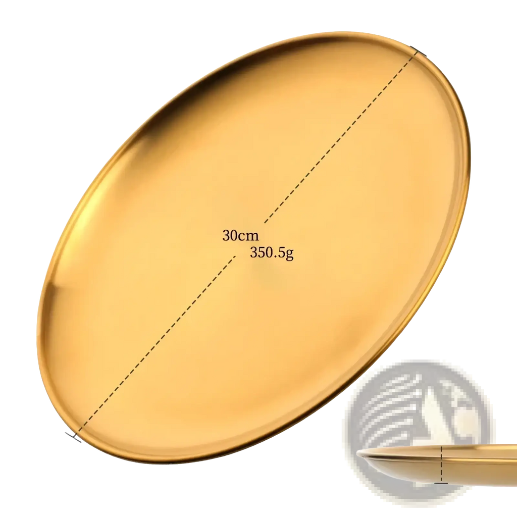 A sleek, oval-shaped gold-colored stainless steel dinner plate with smooth reflective surface and raised edges