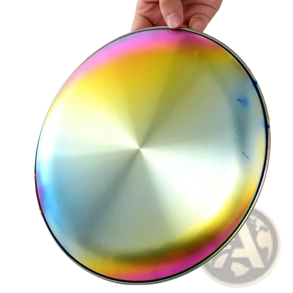 Stainless steel dinner plate with an iridescent rainbow gradient finish and concentric circular patterns for serving