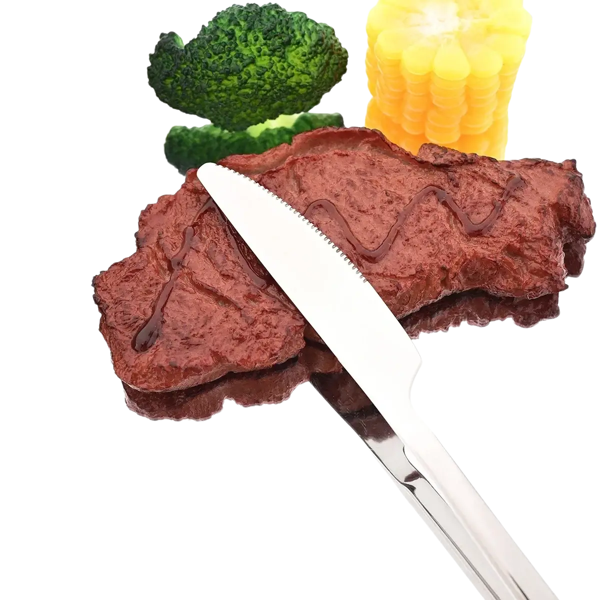 A shiny stainless steel dinner knife rests diagonally on a dark red plastic steak in a 4 piece dinnerware set