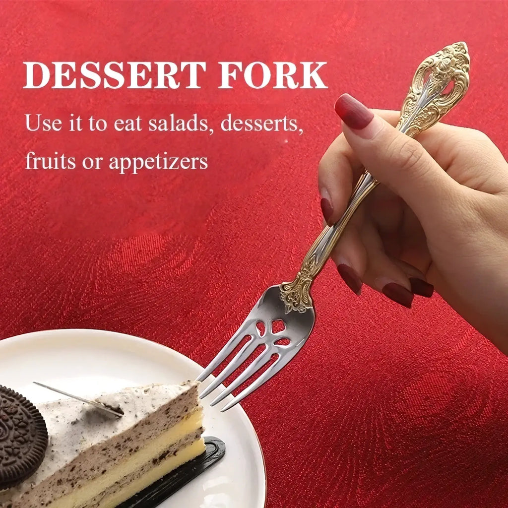 Elegant gold and silver stainless steel dessert fork with ornate filigree detailing in gold inlaid cutlery set