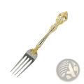 Ornate stainless steel flatware fork with gold inlaid accents and intricate floral detailing on the handle