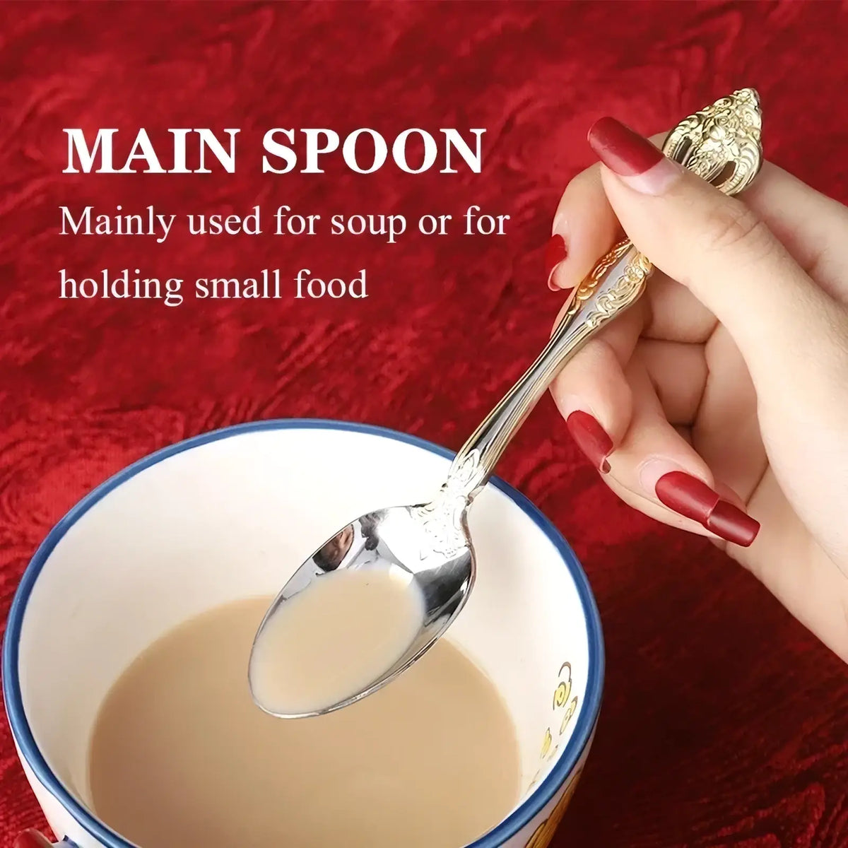An ornate silver spoon with gold inlaid handle from stainless steel flatware set held above a bowl of soup