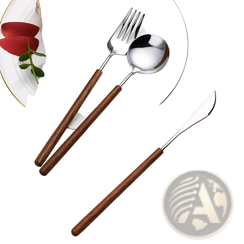 Stainless steel flatware set with warm brown wooden handles arranged on a white plate beside layered cake