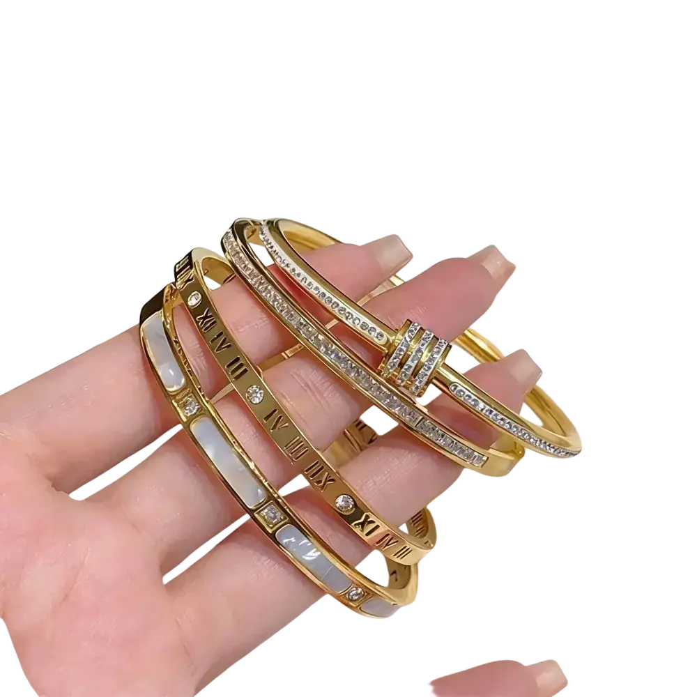 A collection of stainless steel gold roman numeral bangle bracelets for women with crystals and white enamel accents
