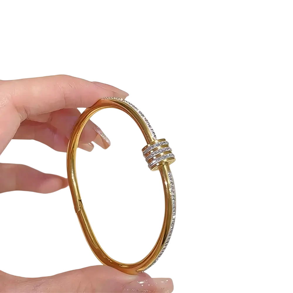 Gold-toned stainless steel bangle bracelet for women with clear stones and triple-layered clasp in a modern design