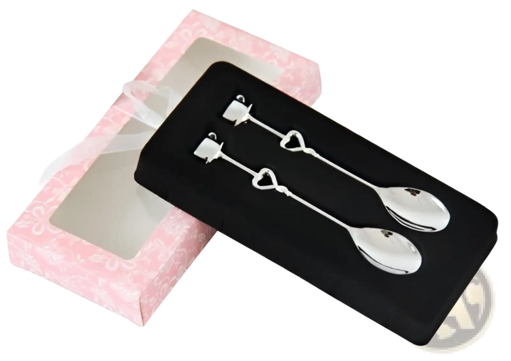 A pair of silver stainless steel heart-shaped coffee spoon charms with polished handles and rounded bowls