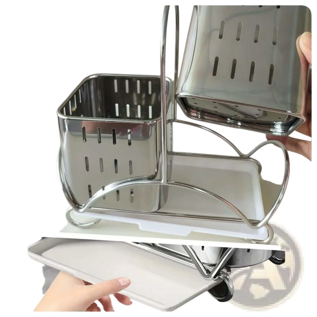 Stainless steel kitchen utensil holder organiser with white plastic tray base and perforated rectangular compartments