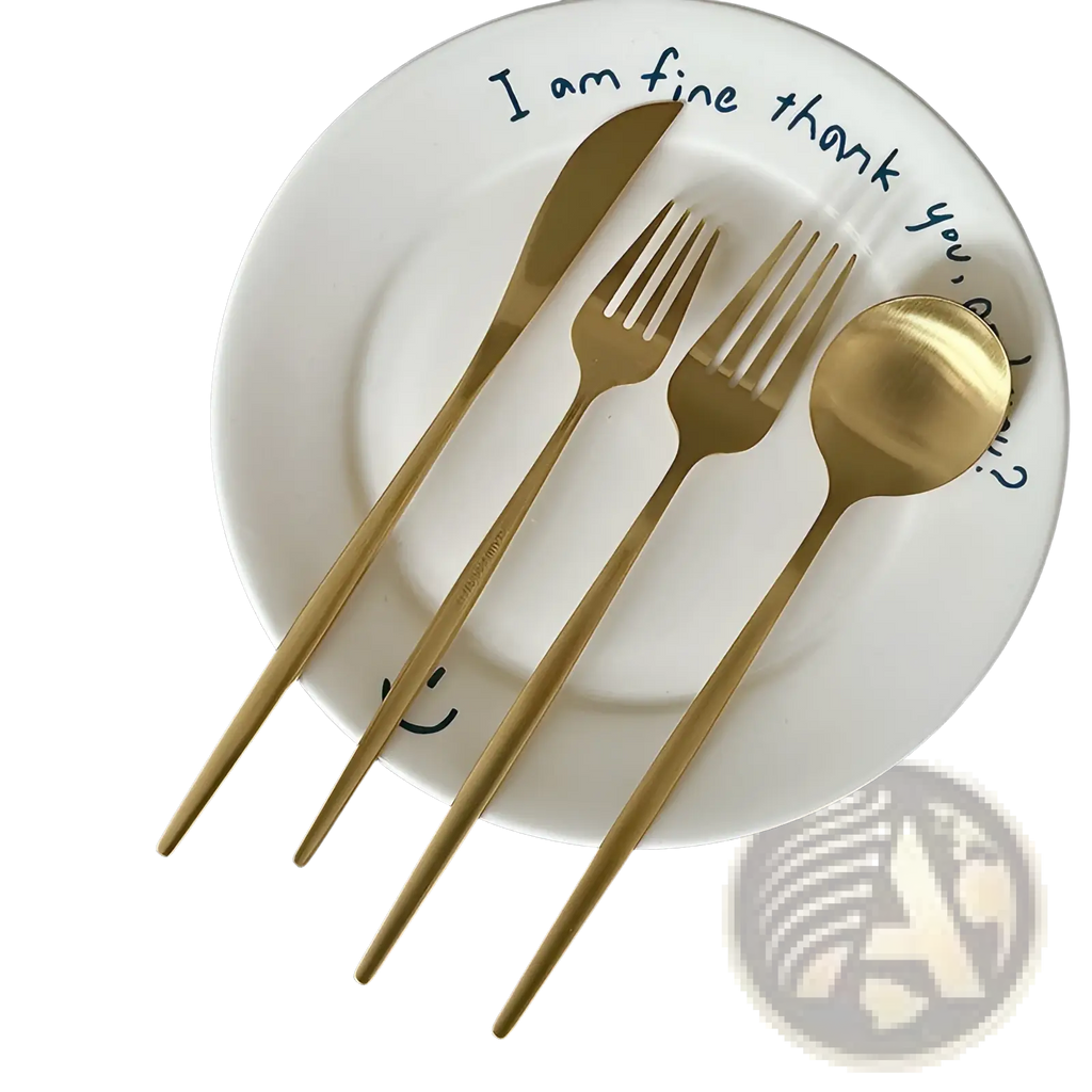 Gold-colored stainless steel matte cutlery set with knife fork and spoon arranged on a white plate for minimalist flatware