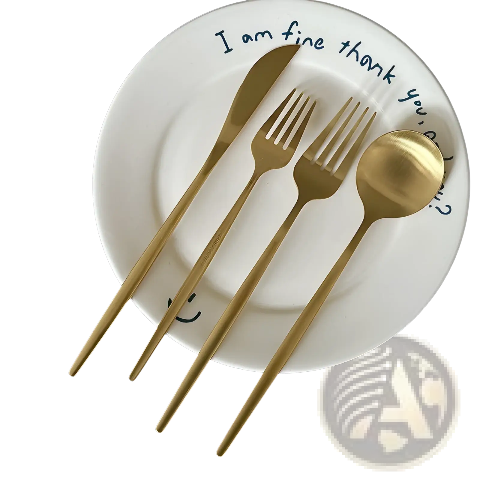 Gold-colored stainless steel matte cutlery set with knife fork and spoon arranged on a white plate for minimalist flatware